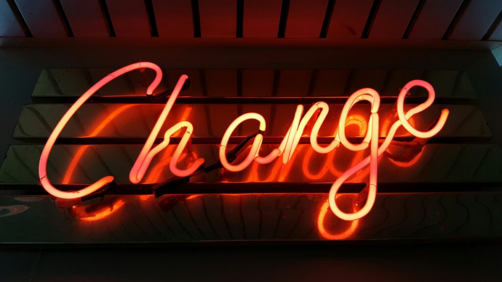 Orange and yellow neon "change" sign